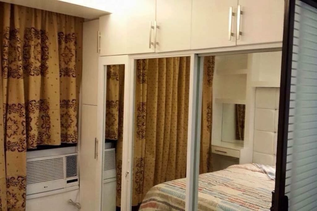 The closet fronting the bed.