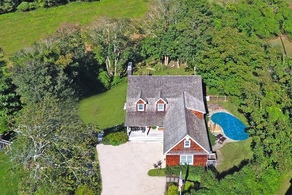 Heated pool, specimen trees, overlooking farm fields