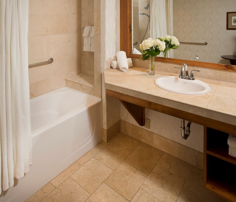 Prepare for the day in the luxurious marble bathroom.