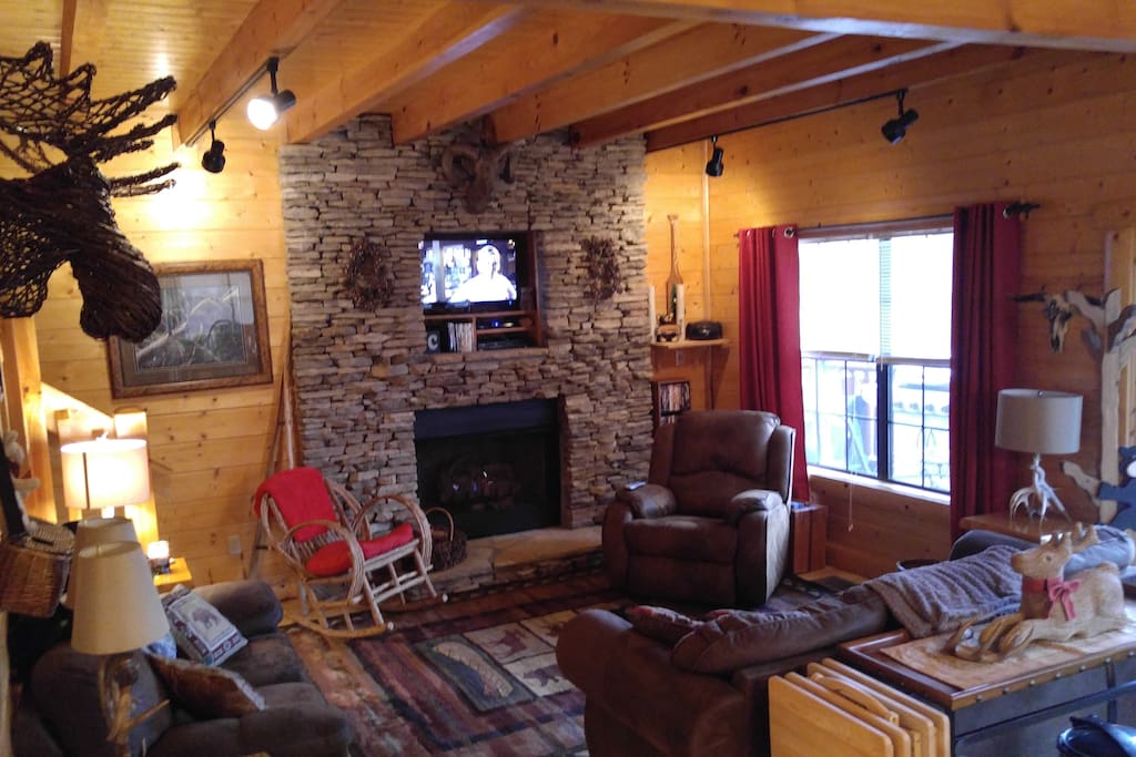 Living Area on Main Floor. Floor to Ceiling Stone Gas Fireplace.