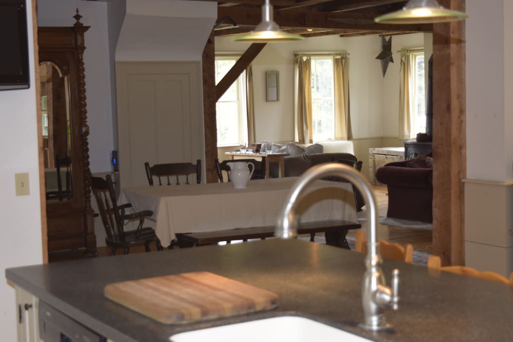 View from kitchen into the open concept dining and living areas of the house.