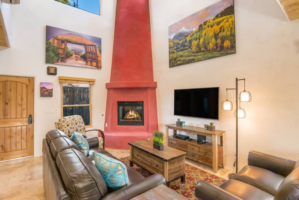 Living room with fireplace and TV