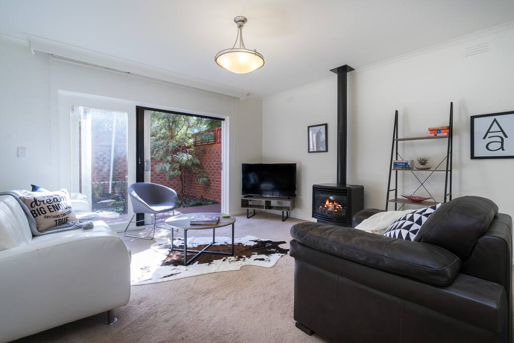 The lounge room is cosy and warm in the winter with the gas log fire