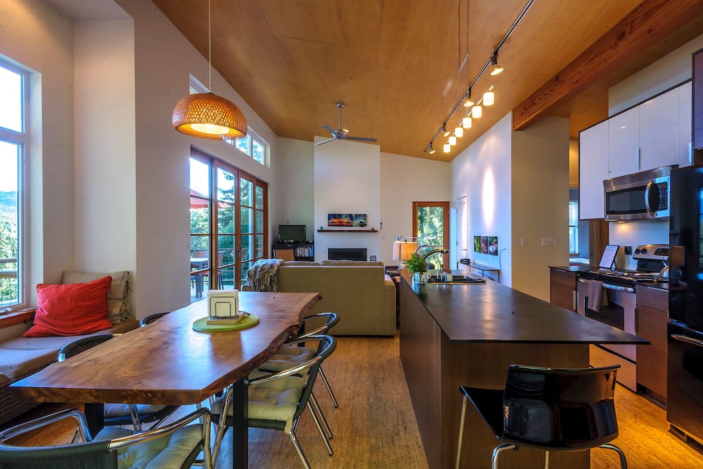 Airy open plan living with cork floors and vaulted wood ceiling.