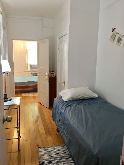 Bedroom is in between 2 other bedrooms. You have 3 doors, but only 1 is used. The other 2 lock. The one you use lets you into the hall where u then cross into the other living room.