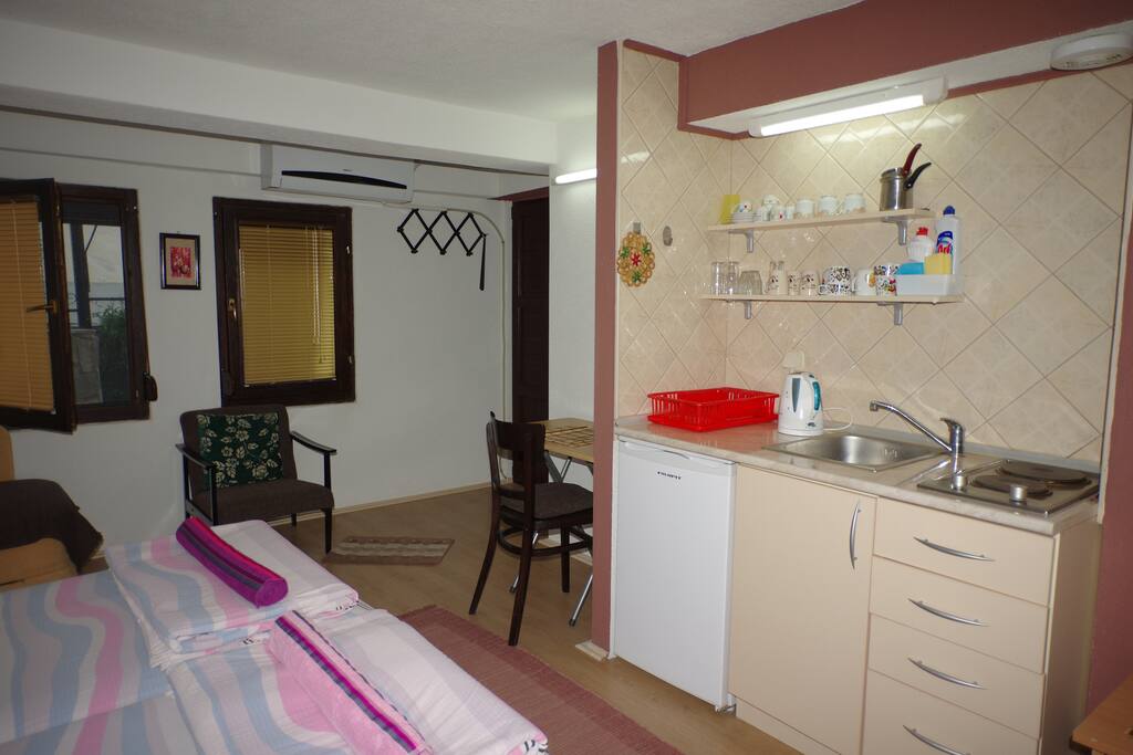 Kitchenette with mini fridge and desk