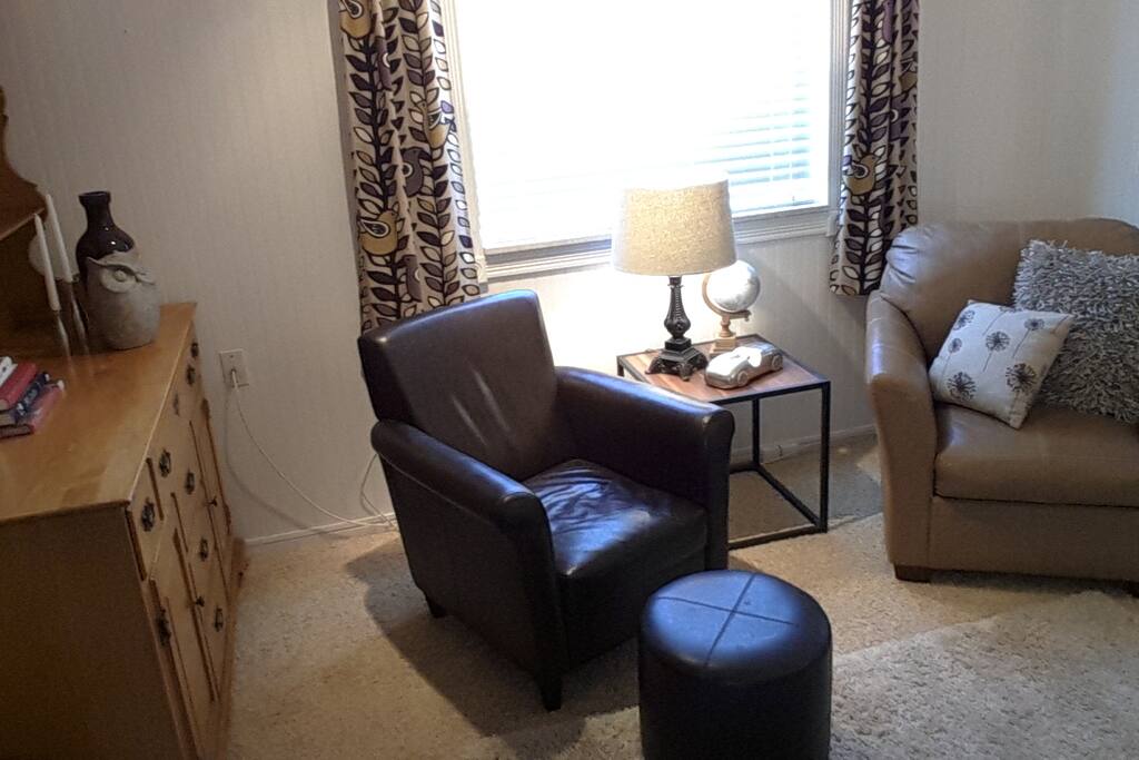 Your private sitting room has 2 comfy chairs for watching TV or just relaxing.