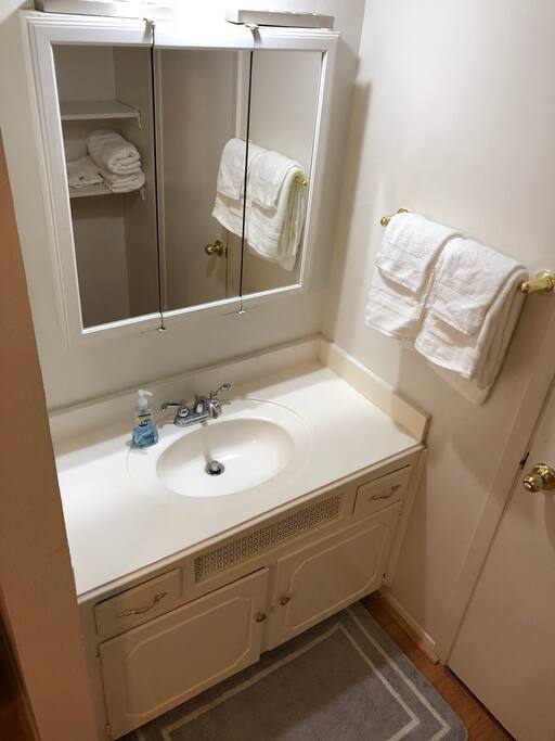 Private vanity area. Door leading to bathroom.
