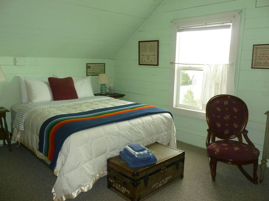 The Green Room is furnished with a QUEEN size bed, extra blankets & comfy pillows, a dresser, and closet storage space.