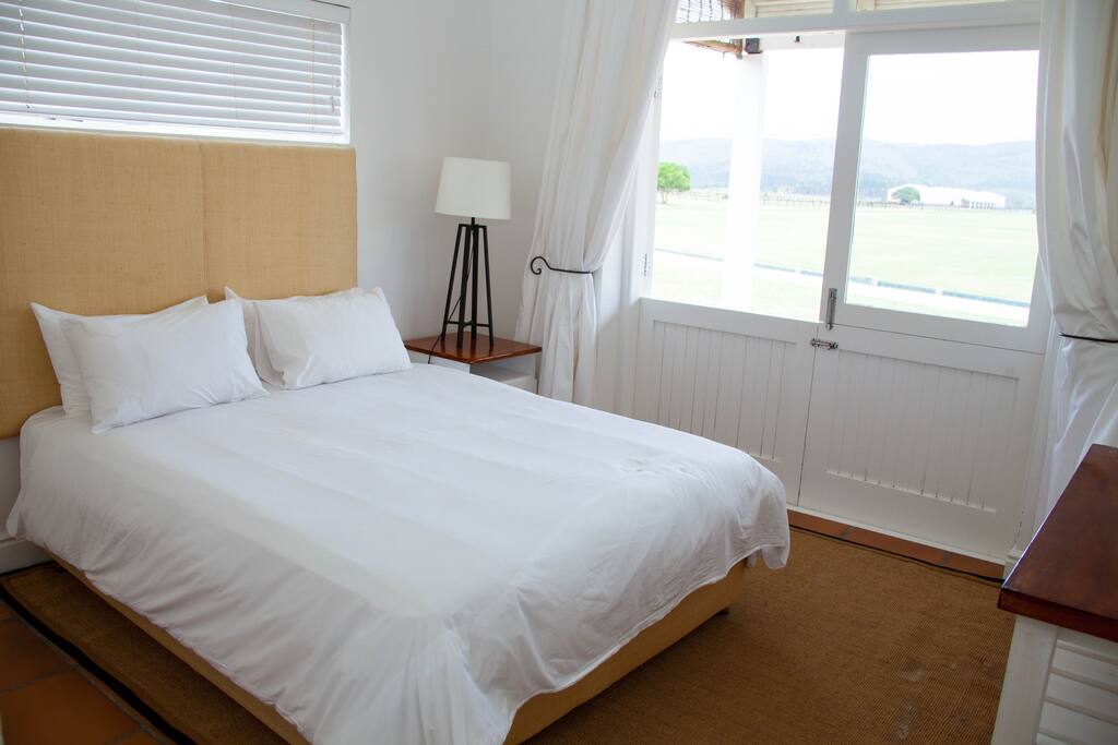 Queen size bed view of Polo field