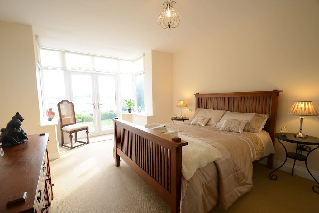 The large Master Bedroom has a King Size bed, stunning views and a full En Suite with Bath and shower.