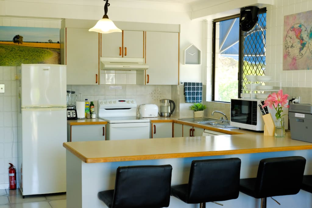 Well-equipped main kitchen so you can cook your meals & save money!
Pull up a bar stool and enjoy your meal or a chat. We also have a laser printer/ B&W copier/ scanner you can use.