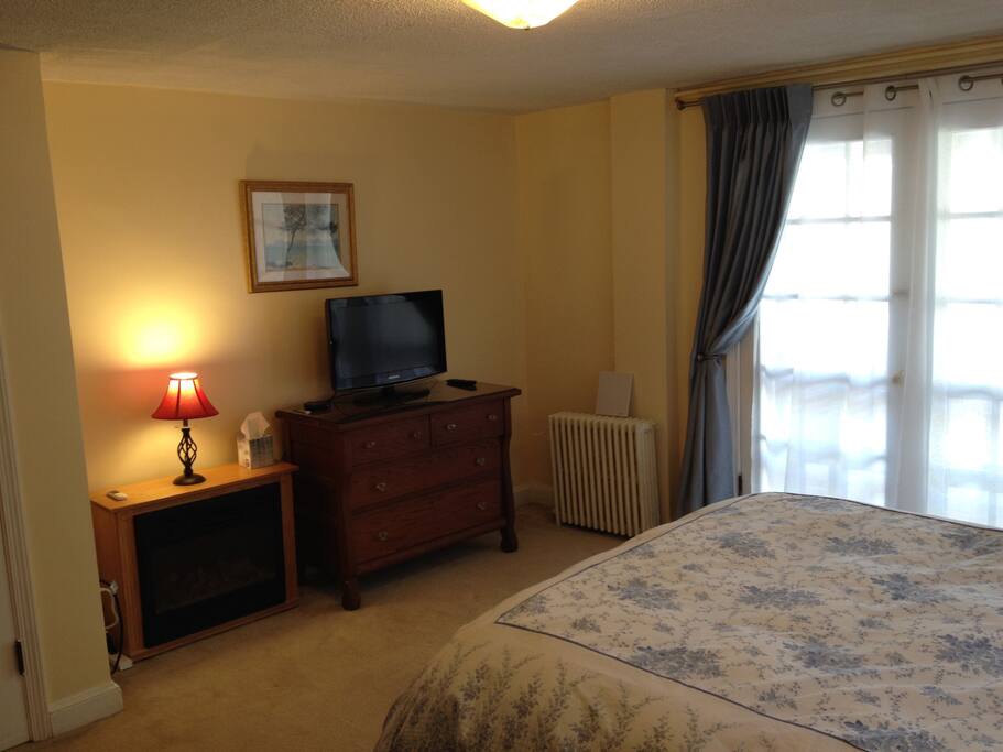Dresser, TV, and electric fireplace