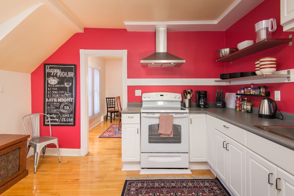 Updated kitchen is fully stocked with pots and pans, cooking utensils, dishes and glassware