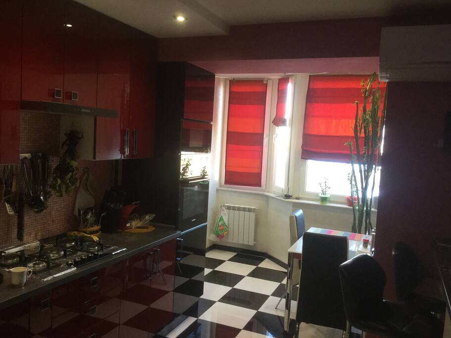 Kitchen( microwave, grill oven,gas,coffee maker,)- Bosh appliances, dining area and a tropical cactus that clears the air for residents.