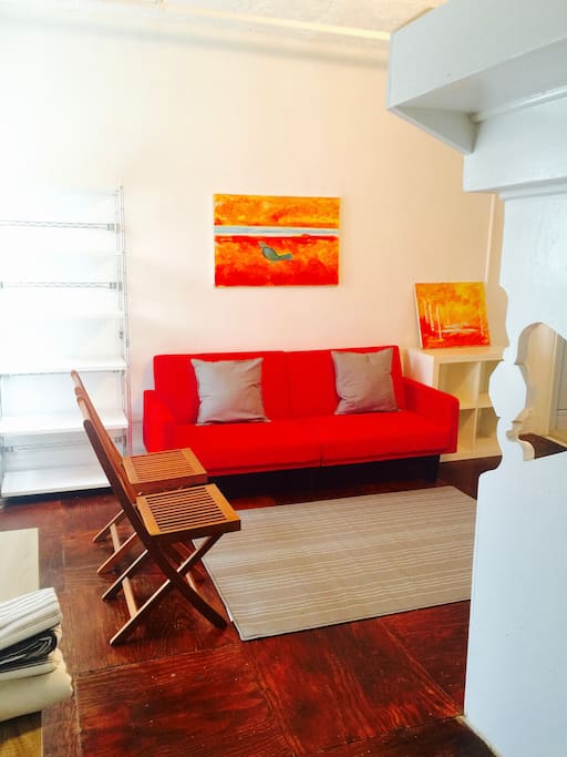 Full futon sofa provides additional sleeping area.
