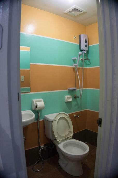 Clean Toilet and Bath with shower and heaters on every private room of Bossing Dormitel.