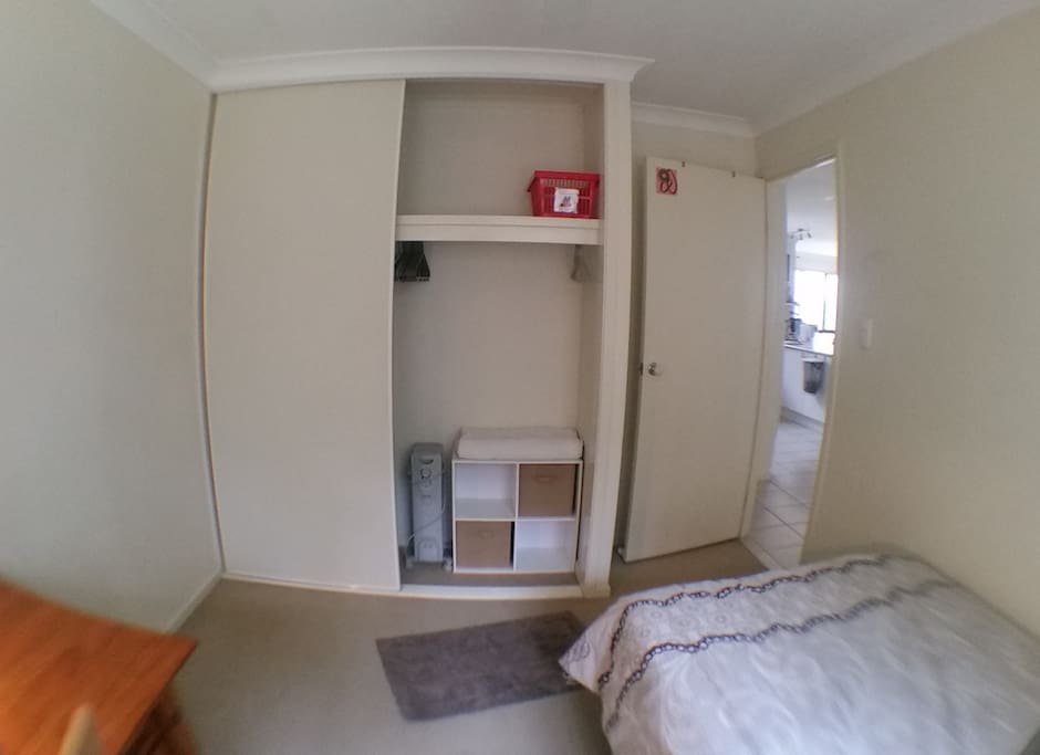 Large wardrobe with heater, blanket, coat hangers and small shelf unit with plenty of room if you wish to unpack and settle in