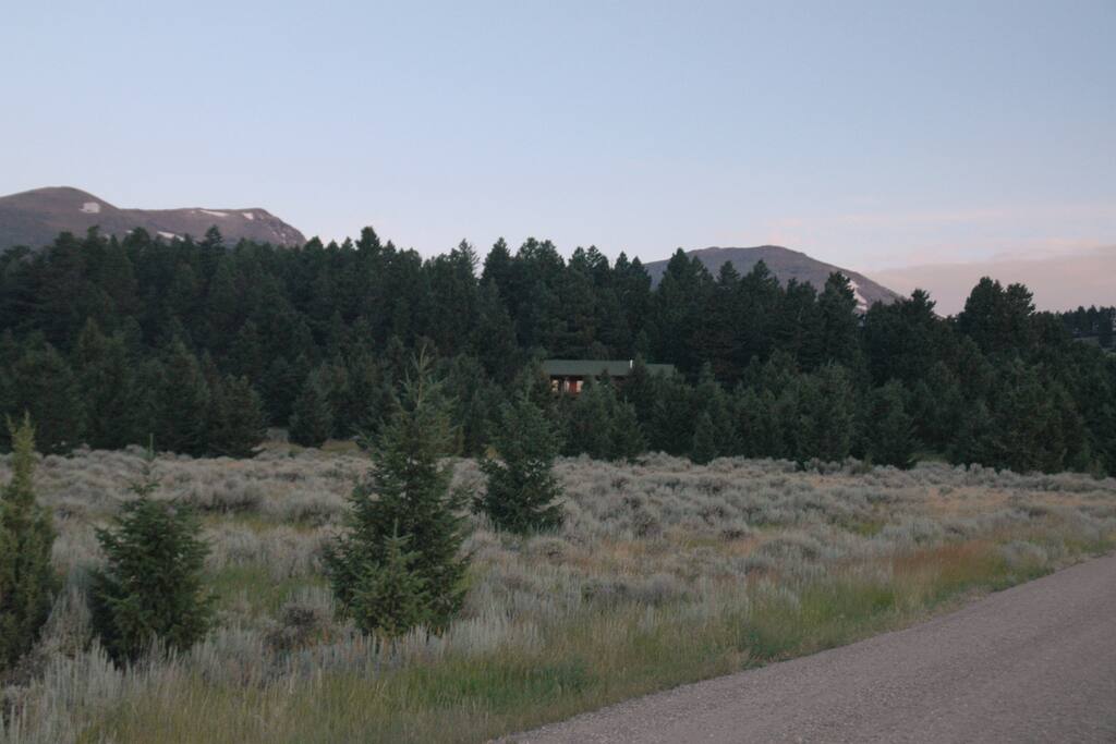 Madison Mountain Oasis, tucked in the trees, with the Tobacco Root Mountains just behind.