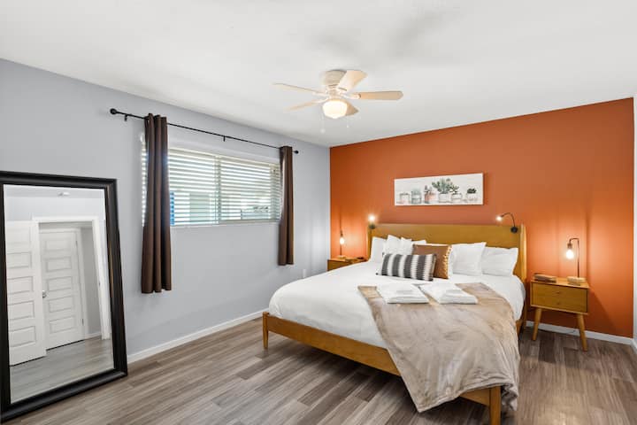 The huge bedroom offers a very comfortable king-sized Tuft & Needle mattress with lots of pillows and a cozy blanket. Reading lights mounted to the bed, USB chargers on both night stands, a large floor mirror, and blackout curtains finish the room. 