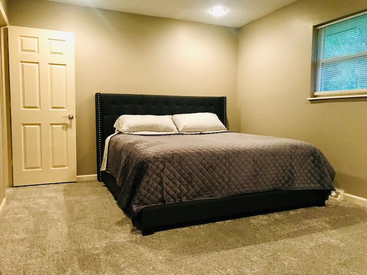 Master bedroom with King Sized bed and Smart TV