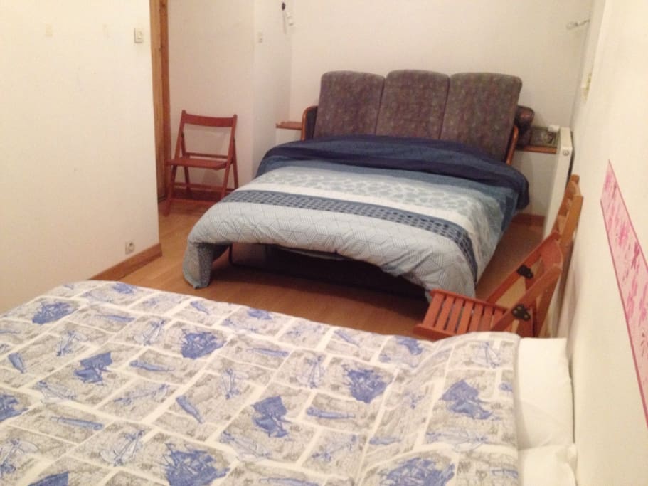 One large double bed, one small double bed, four folding chairs