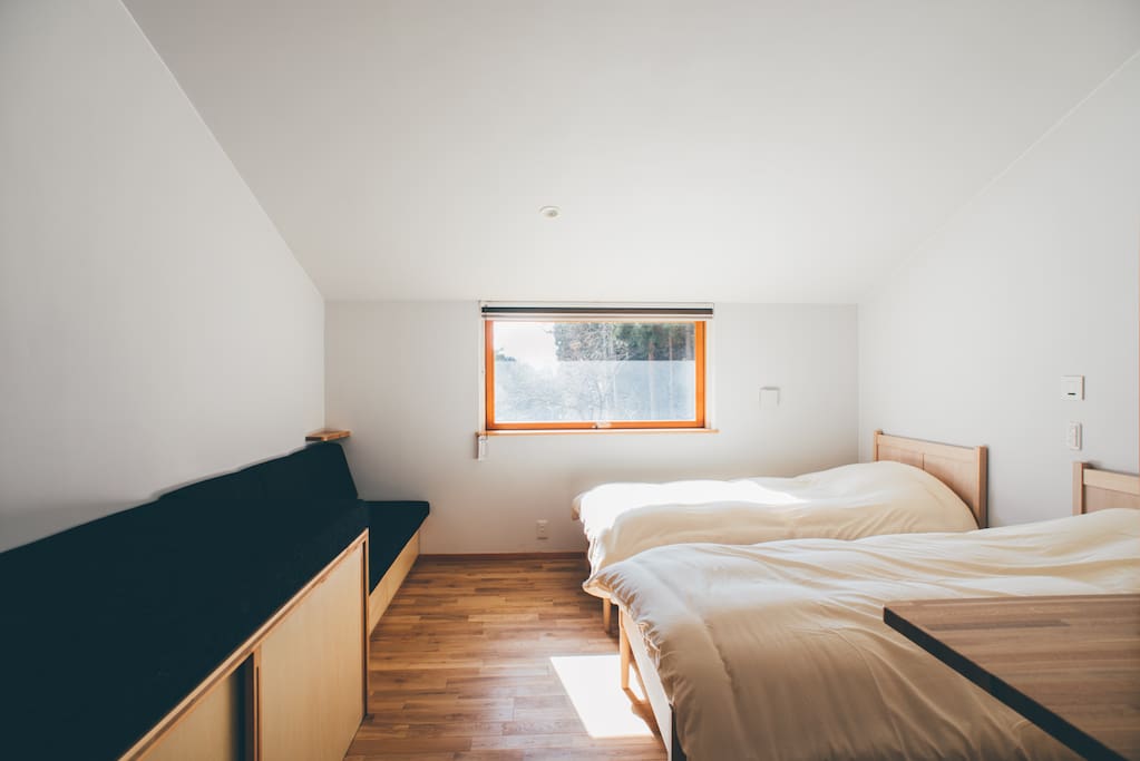 Cozy room with organic cotton linen accommodates four person