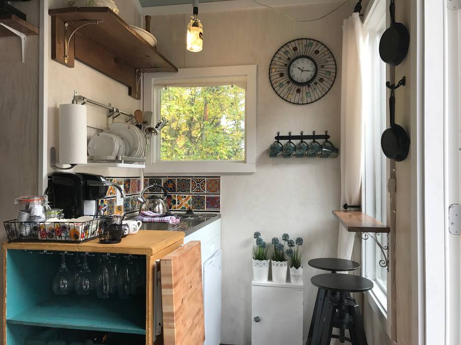 Kitchen with fridge, sink, and stove