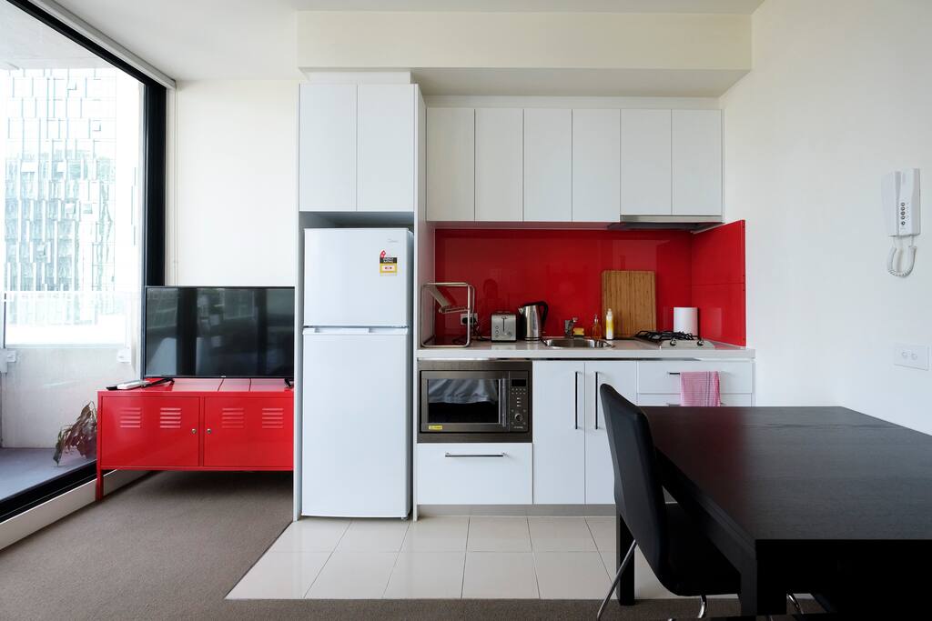 Well-equipped kitchen for basic cooking and dining.