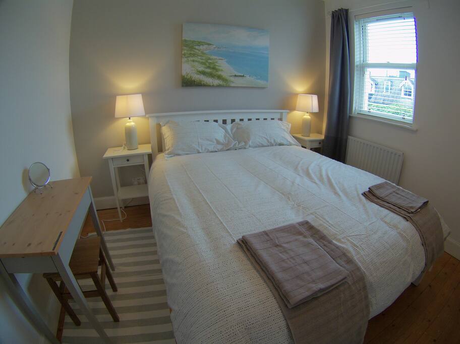 Master bedroom with king size bed.