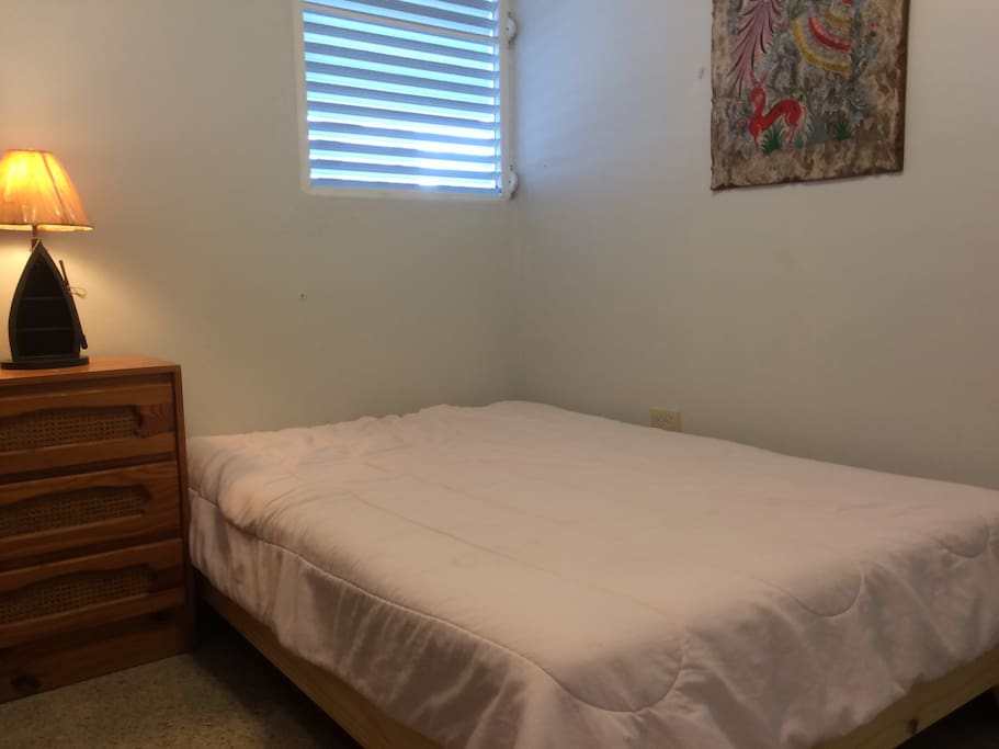 The room has three beds. This bed is full size.