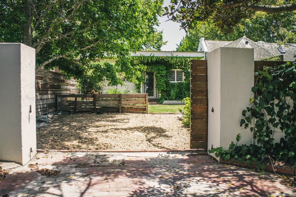 View of private entrance, cottage, parking & garden
