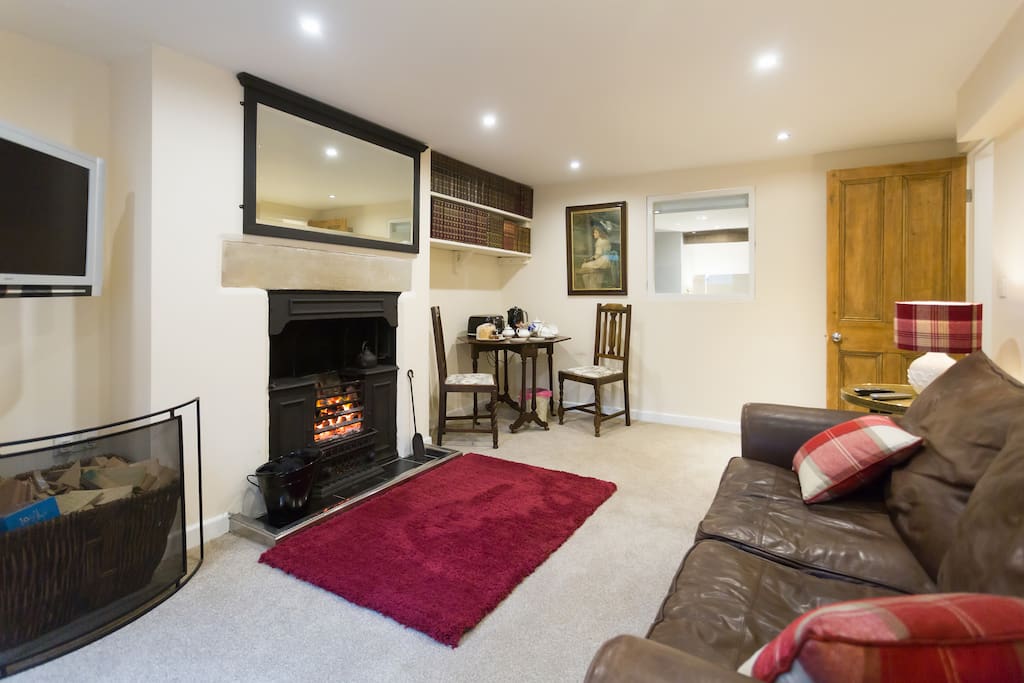 A large mirror above the fireplace, a fire guard to use when you nip out or go to bed