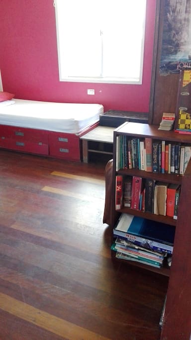 A little library in the entrance of the room, choose one and chill out!
(The second bed of the room in background)