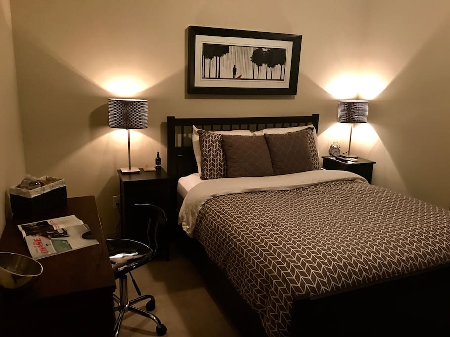 Your bedroom. Queen size bed and writing desk.