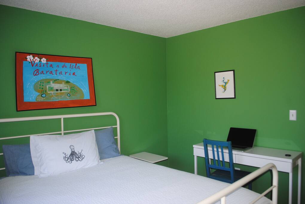 Bedroom includes closet storage, working area, and partial lake view.