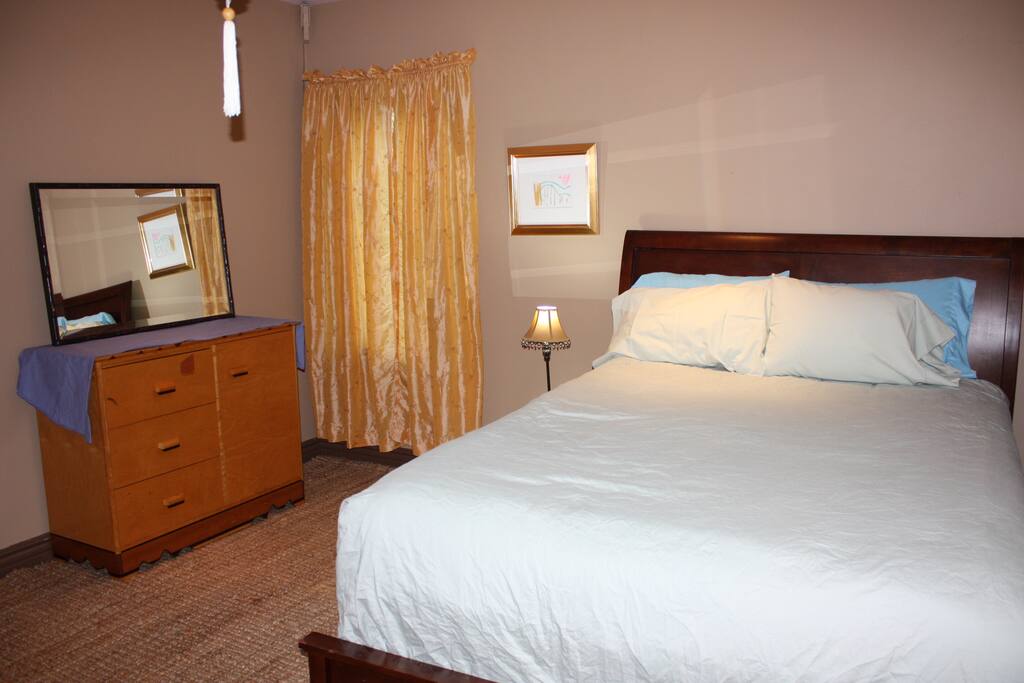 Queen Bed in a light and airy room
