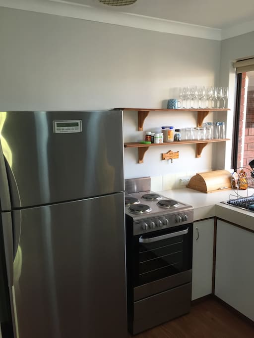 Full size fridge and fully equipped kitchen