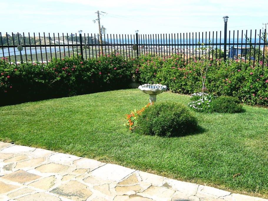 Garden with ocean and river in background