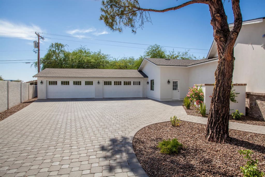 The long driveway with four car garage space.
