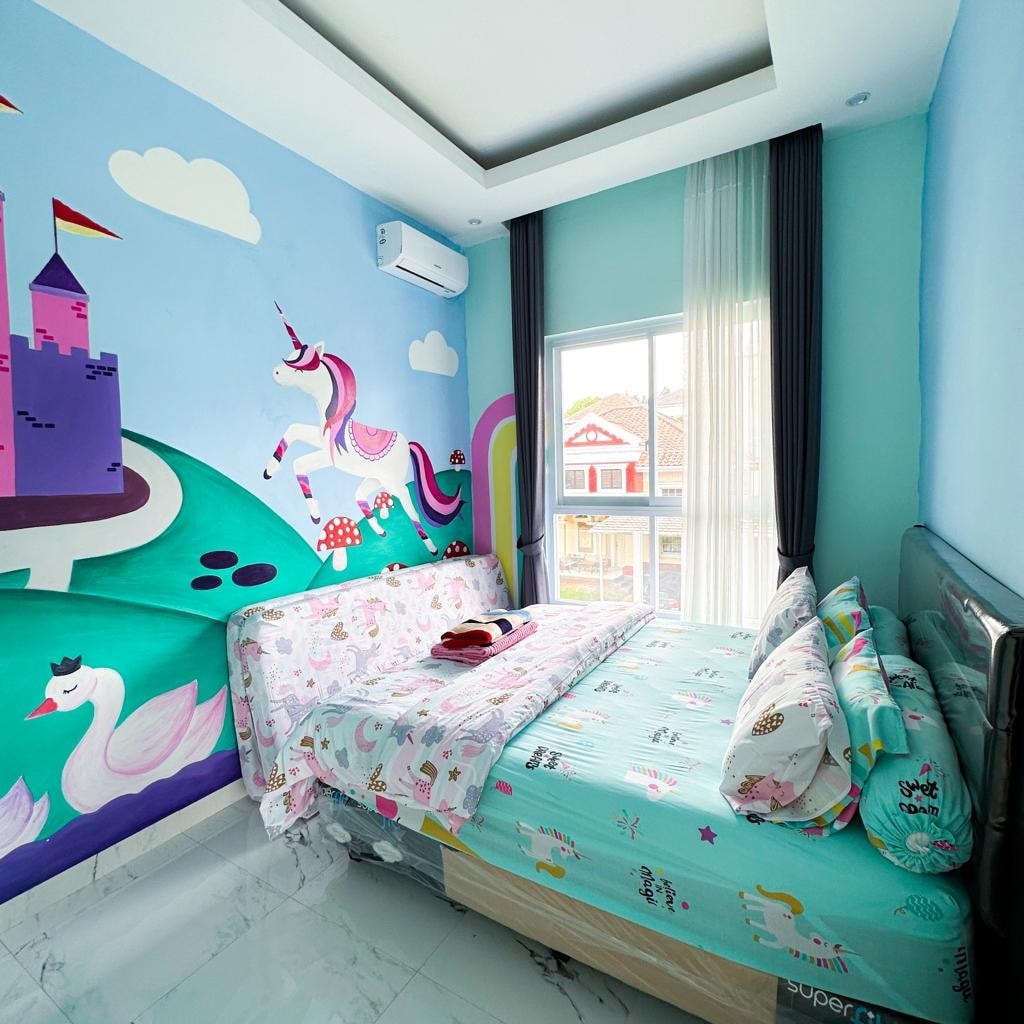 A colorful children's room features whimsical wall murals of unicorns and swans. A spacious bed is adorned with playful bedding, complementing the vibrant decor. Natural light fills the room through a large window dressed with sheer curtains, enhancing the cheerful atmosphere.