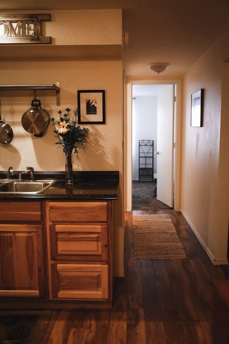 Hallway leading to bathroom and twin bedroom