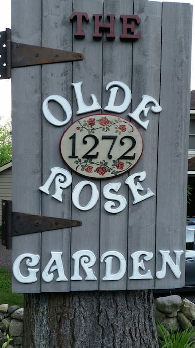 The history of this home is that it used to be a bar/restaurant which opened in 1938. It was called the Rose Garden. We made this sign to help folks find us. It is posted on a tree in the front of the house. Welcome....to the Olde Rose Garden!
