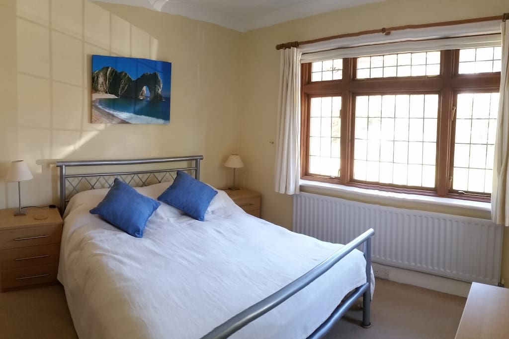 Large comfortable light quiet double room with morning sun. Bedside lights, sockets.