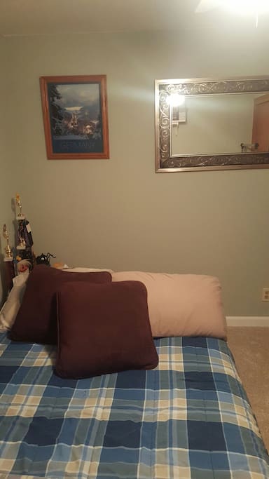 Comfy double bed, lots of extra pillows and blankets.