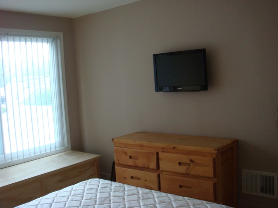 Room 1 Six drawer dresser & wall mounted TV.