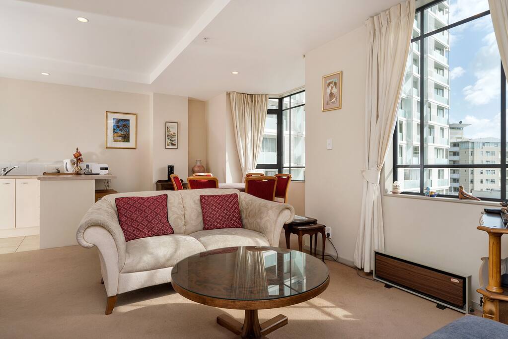 Comfortable sunny living area with TV and unlimited wifi.