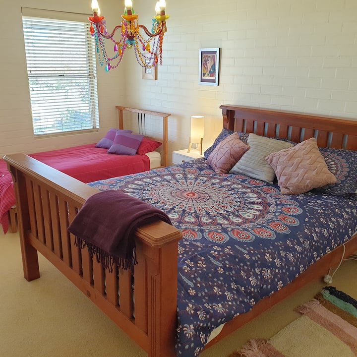 "Rainbow room " QB + SB plus room for BYO cot. A good family bedroom. Access/en suite to bathroom 2. Hanging facilities in the access to bathroom. Electric blankets, portable fan heater and portable cooling fan