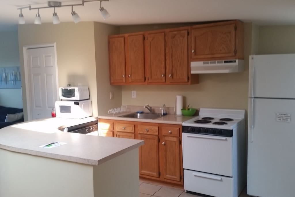 Kitchen with
refrigerator, oven/stovetop, microwave, and toaster oven. Complimentary bananas, yogurt, eggs, milk, and coffee.