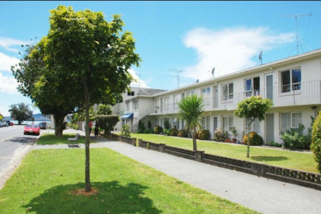 Our gorgeously retro block of apartments with the beach in the background.